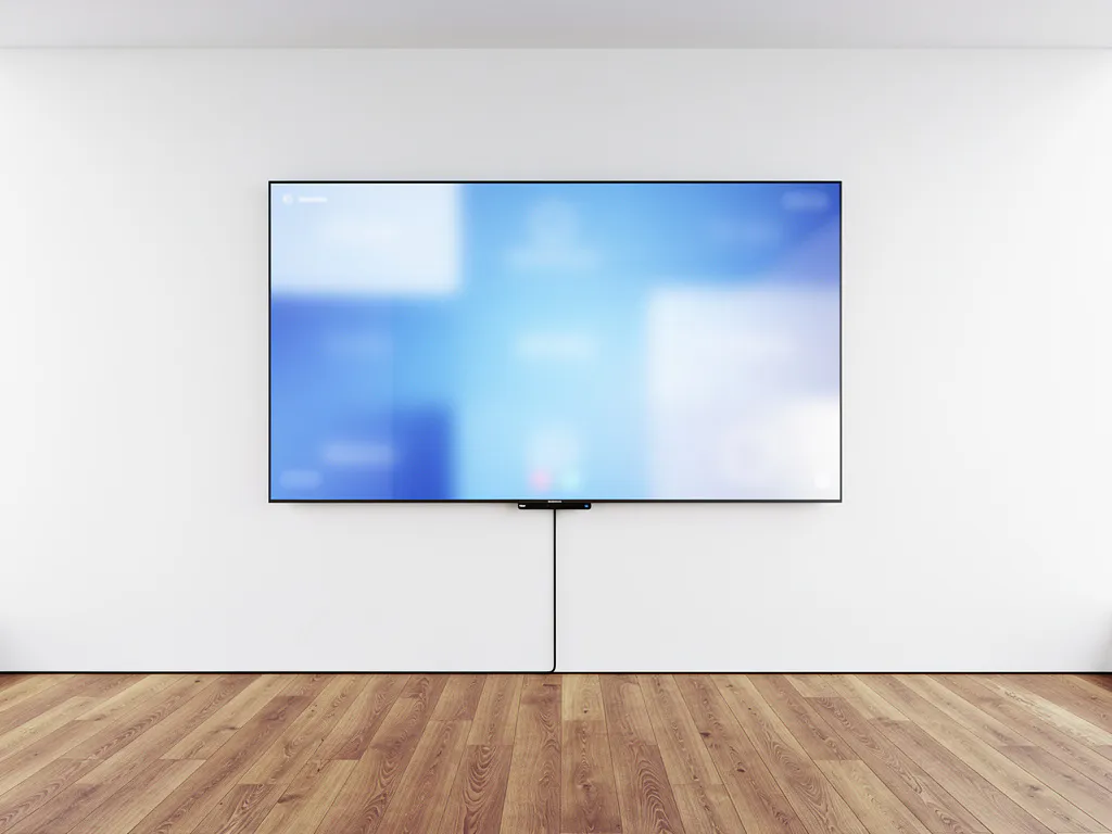 Groot 90-inch touchscreen op witte muur in moderne vergaderruimte met blauw schermgloed en warm eiken vloer.