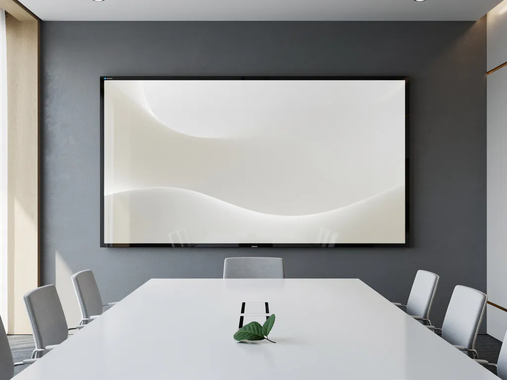 Opgeknapte 90-inch touchscreen in vergaderzaal met groen blad op witte tafel, minimalistische stijl in grijs en wit.